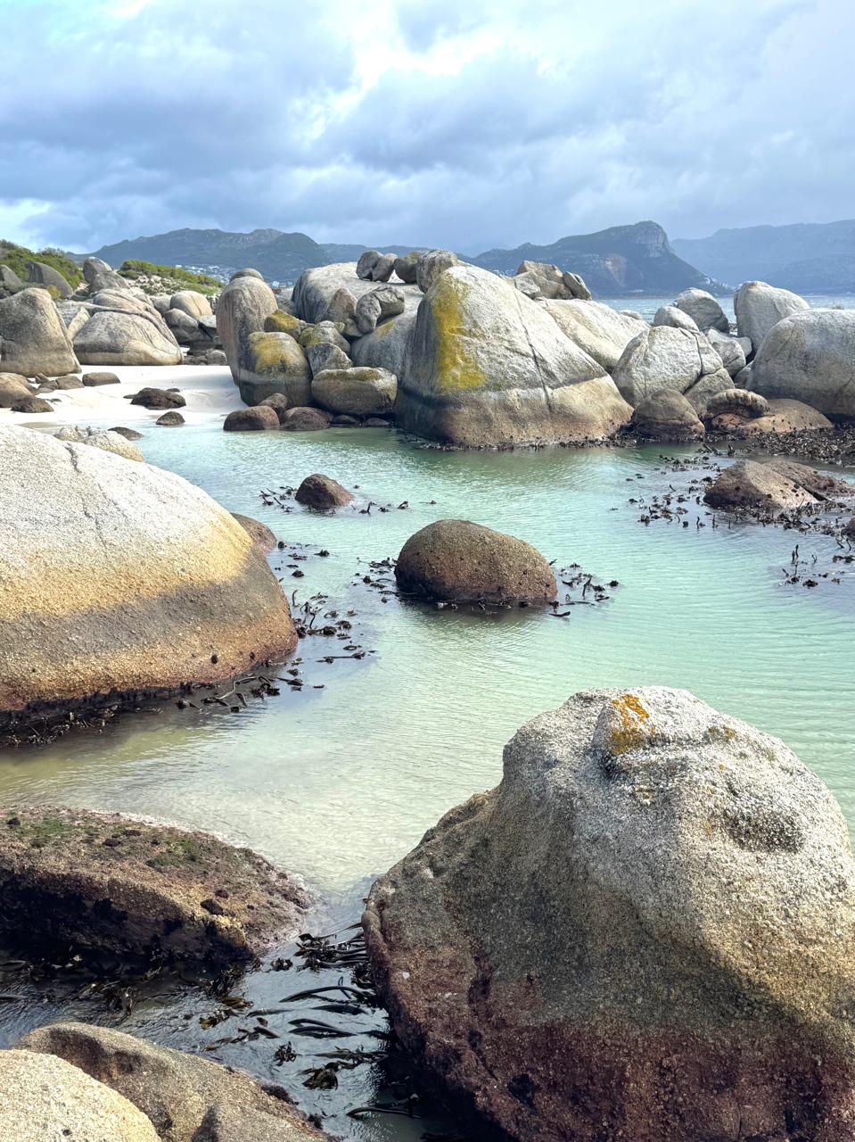 Granite boulders and a turquoise pool at Boulders