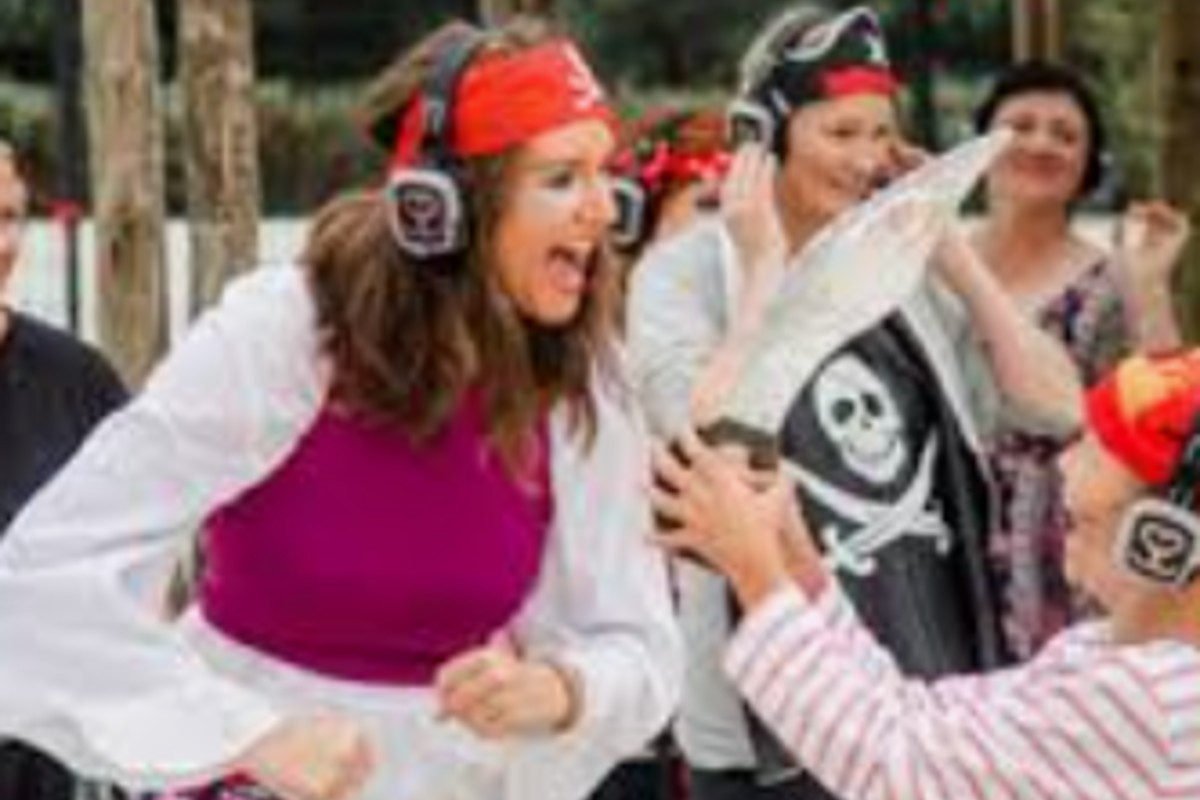 Costumed guests in silent disco headphones