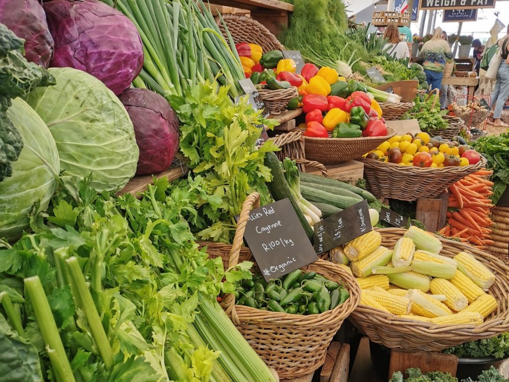 Fresh vegetables piled in baskets at a Cape Town farm market